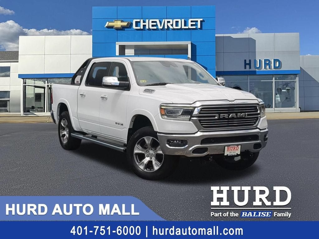 2021 RAM 1500 Laramie Crew Cab 4x4 5'7" Box in White — front three-quarter view