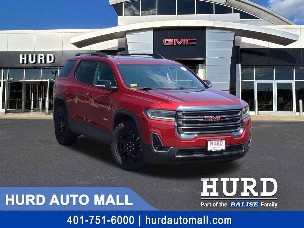 2023 GMC Acadia AT4 in Volcanic Red Tintcoat — front three-quarter view