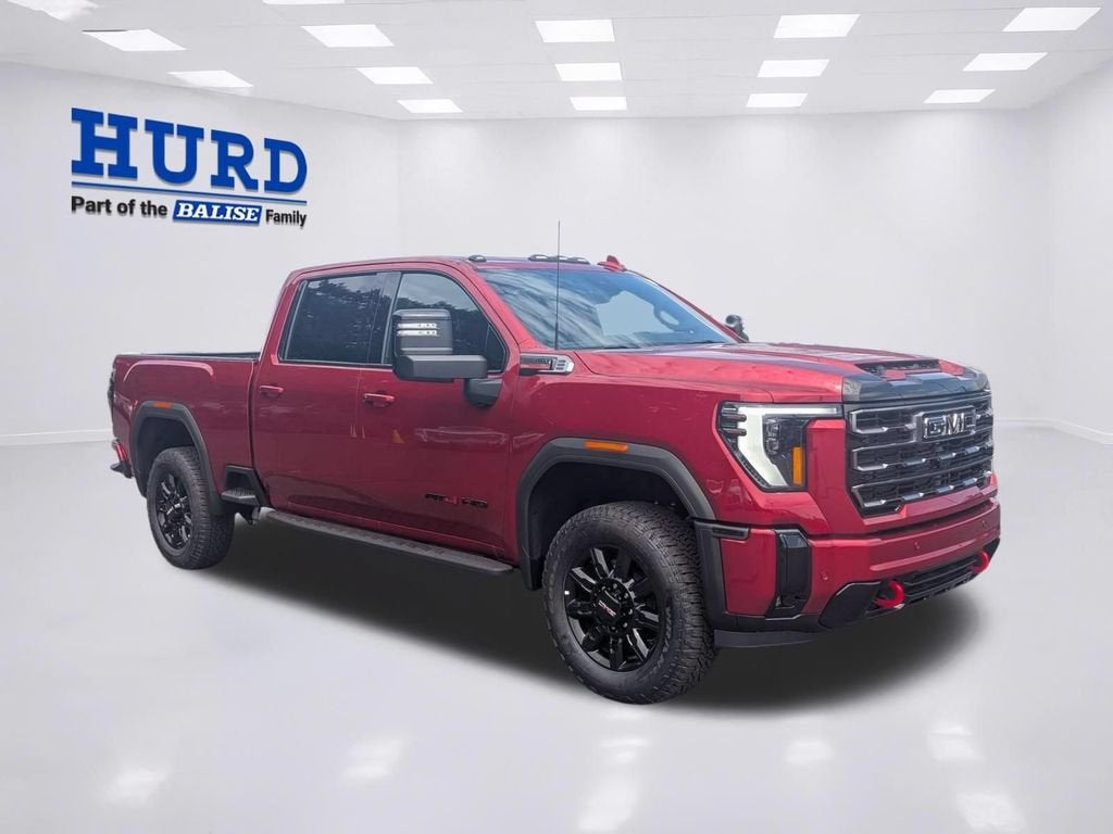 2026 GMC Sierra 2500 HD AT4 in Volcanic Red Tintcoat — front three-quarter view