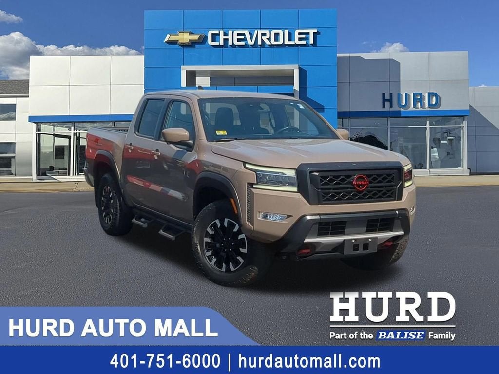 2023 Nissan Frontier Crew Cab PRO-4X 4x4 in Beige — front three-quarter view